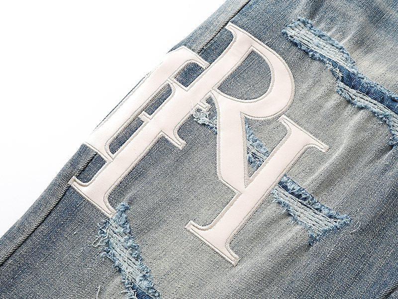 AMIRI Light Blue Distressed Letter Graphic Jeans ¡ª detail