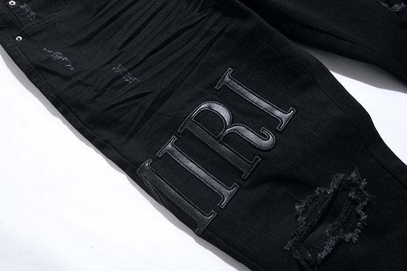 AMIRI Black Distressed Lettering Jeans ¡ª detail