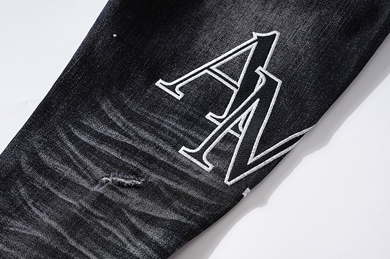 AMIRI Black Distressed Letter Graphic Jeans ¡ª detail