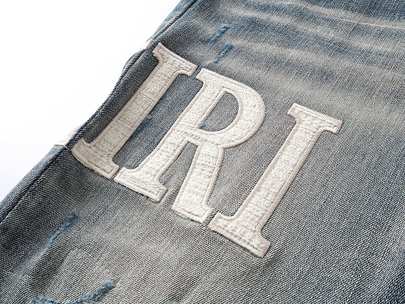 AMIRI Light Blue Distressed Letter Applique Jeans ¡ª detail