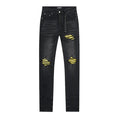 AMIRI Yellow-Backed Distressed Black Jeans ¡ª front