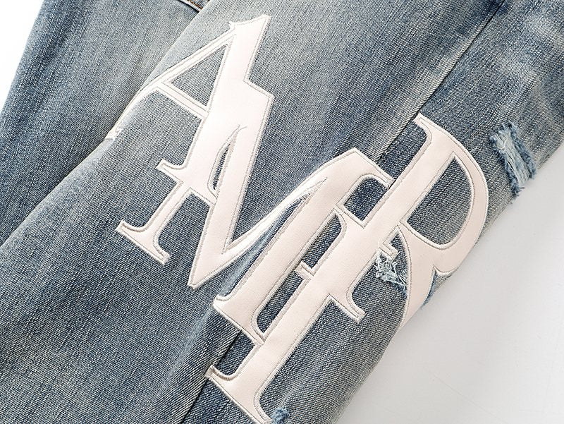 AMIRI Light Blue Distressed Appliqu¨¦ Jeans ¡ª detail