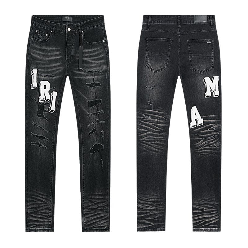 AMIRI Varsity Letter Appliqu¨¦ Distressed Jeans ¡ª hero