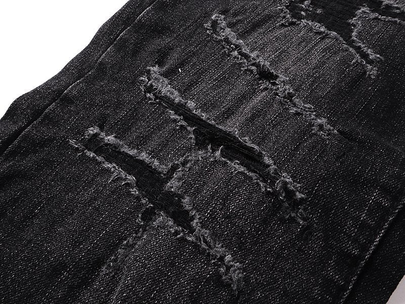 AMIRI Varsity Letter Appliqu¨¦ Distressed Jeans ¡ª detail