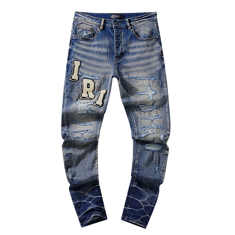 AMIRI Varsity Letter Appliqu¨¦ Distressed Jeans ¡ª hero
